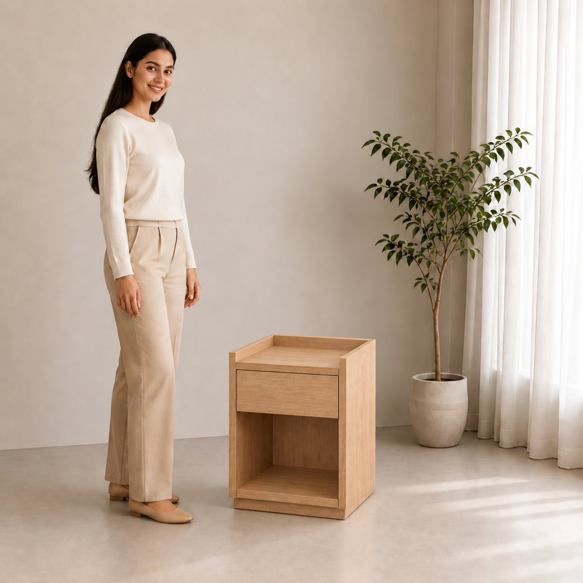 Right Work Tray oak side table, three-quarter lifestyle view with smiling woman against beige background