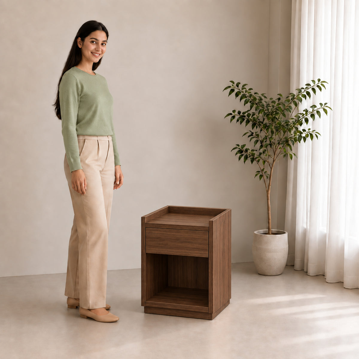 Right Work Tray walnut side table, three-quarter lifestyle view with smiling woman against beige background